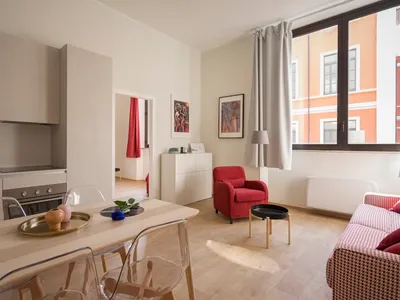 Minimalist studio apartment in Grünerløkka Oslo with open layout and light neutral palette, staged for sale — MT Home